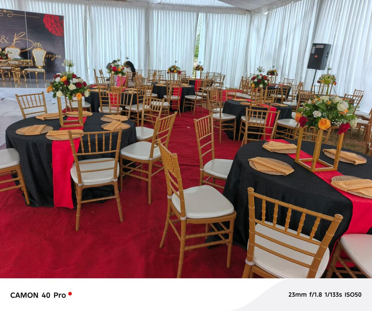 Draped ceiling with floral arrangements by EJD Events