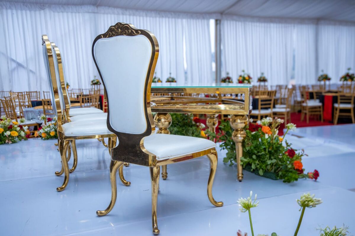 Elegant event decor with gold chairs at EJD Events
